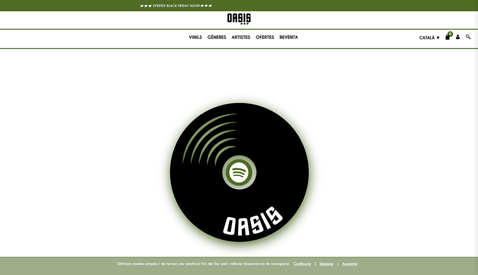  Captura de pantalla de la pàgina web d'Oasis, botiga de vinils. 
Es veu la capçalera verda amb el missatge 'OFERTES BLACK FRIDAY SOON', el logo d'Oasis al centre, el menú de navegació (Vinils, Gèneres, Artistes, Ofertes, Reventa) i una gran imatge d'un disc de vinil negre amb el logo de Spotify al centre i la paraula 'OASIS' a baix.